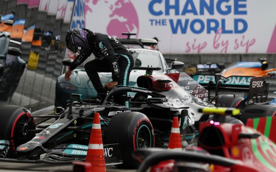 Mandatory Credit: Photo by Yuri Kochetkov/POOL/EPA-EFE/Shutterstock (12465405bj) British Formula One driver Lewis Hamilton (L) of Mercedes-AMG Petronas steps out of his car after the qualifying session of the 2021 Formula One Grand Prix of Russia at the Sochi Autodrom race track in Sochi, Russia, 25 September 2021. The Formula One Grand Prix of Russia will take place on 26 September 2021 - Yuri Kochetkov/POOL/EPA-EFE/Shutterstock 