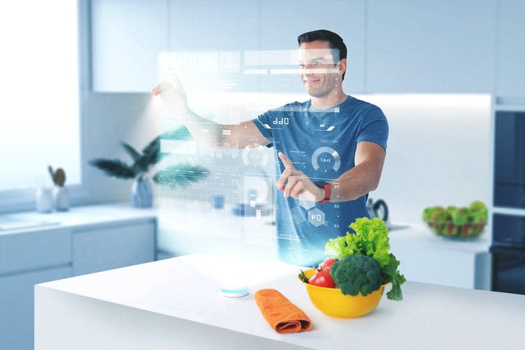 <span class="caption">Kitchen magic.</span> <span class="attribution"><a class="link " href="https://www.shutterstock.com/image-photo/using-holograms-handsome-young-cook-smiling-1163831491?src=uSNLa3BVVS829rDPy9stbA-1-1" rel="nofollow noopener" target="_blank" data-ylk="slk:Dmytro Zinkevych/Shutterstock.com;elm:context_link;itc:0;sec:content-canvas">Dmytro Zinkevych/Shutterstock.com</a></span>