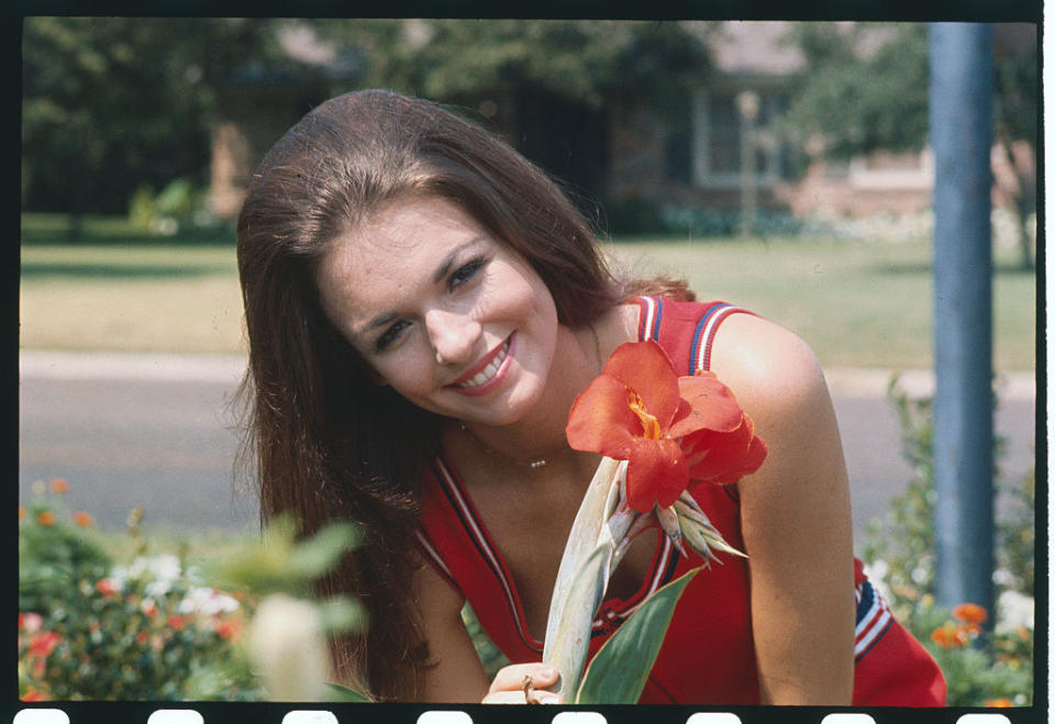 George standing by a flower