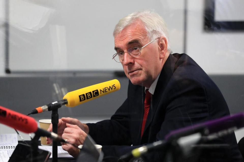 Shadow Chancellor John McDonnell refuses to answer questions on how Labour would handle national debt because 'that's why we have iPads'