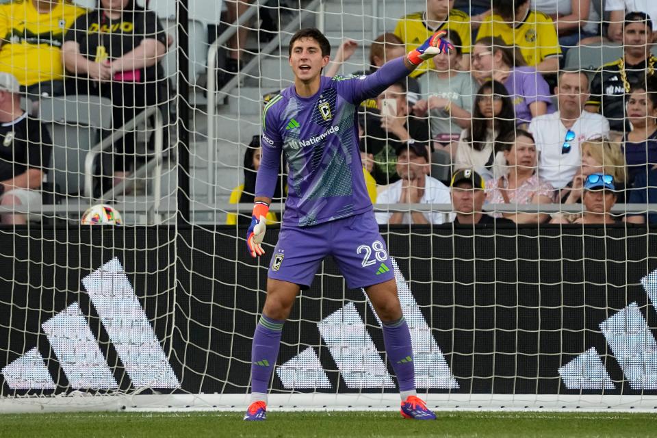 Jul 6, 2024; Columbus, OH, USA; Columbus Crew goalkeeper Patrick Schulte (28) motions during the first half of the MLS soccer match against Toronto FC at Lower.com Field. The Crew won 4-0.