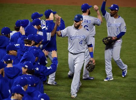 Oct 24, 2014; San Francisco, CA, USA; Kansas City Royals left fielder Alex Gordon (4) celebrates with teammates after defeating the San Francisco Giants during game three of the 2014 World Series at AT&T Park. Mandatory Credit: Ed Szczepanski-USA TODAY Sports