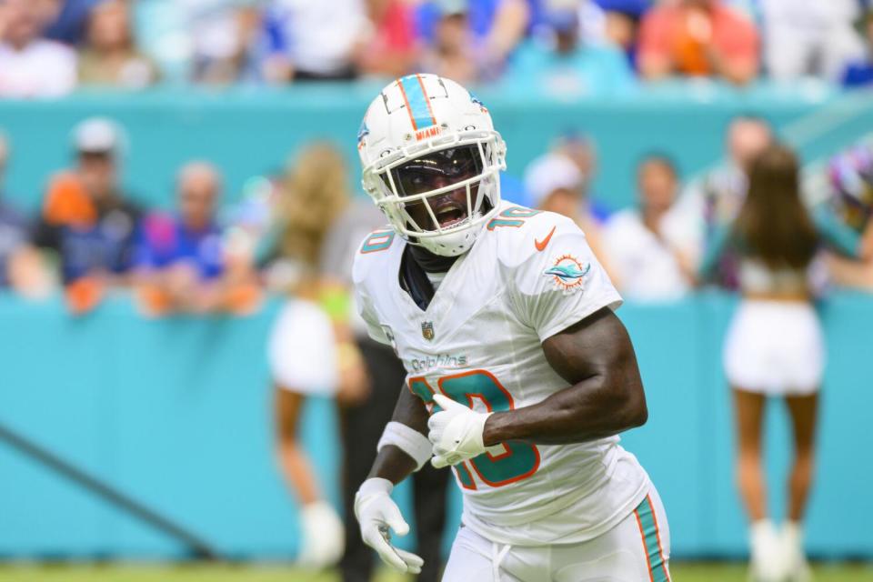 Dolphins wide receiver Tyreek Hill (10) runs off the field in Miami Gardens.