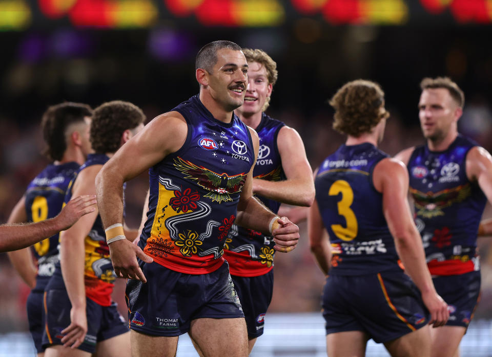 ADELAIDE, AUSTRALIA - MAY 26: Taylor Walker of the Crows celebrates a goal with team mates during the 2024 AFL Round 11 match between Kuwarna (Adelaide Crows) and Waalitj Marawar (West Coast Eagles) at Adelaide Oval on May 26, 2024 in Adelaide, Australia. (Photo by Sarah Reed/AFL Photos via Getty Images)