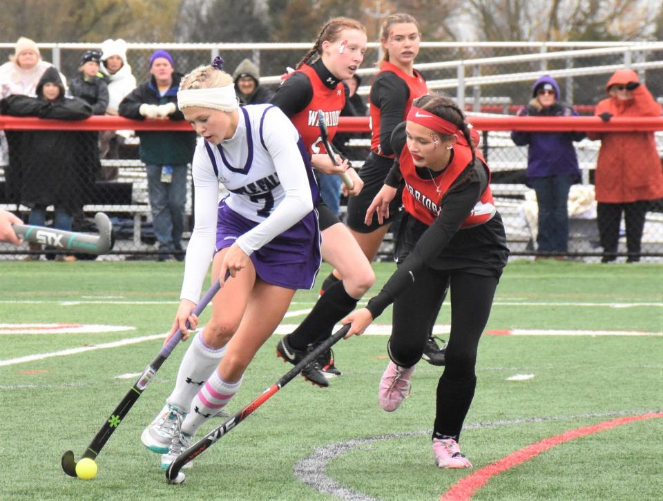 Little Falls Mountie Avery McLaughlin advances the ball against Morrisville-Eaton during Section III's Class D field hockey final.