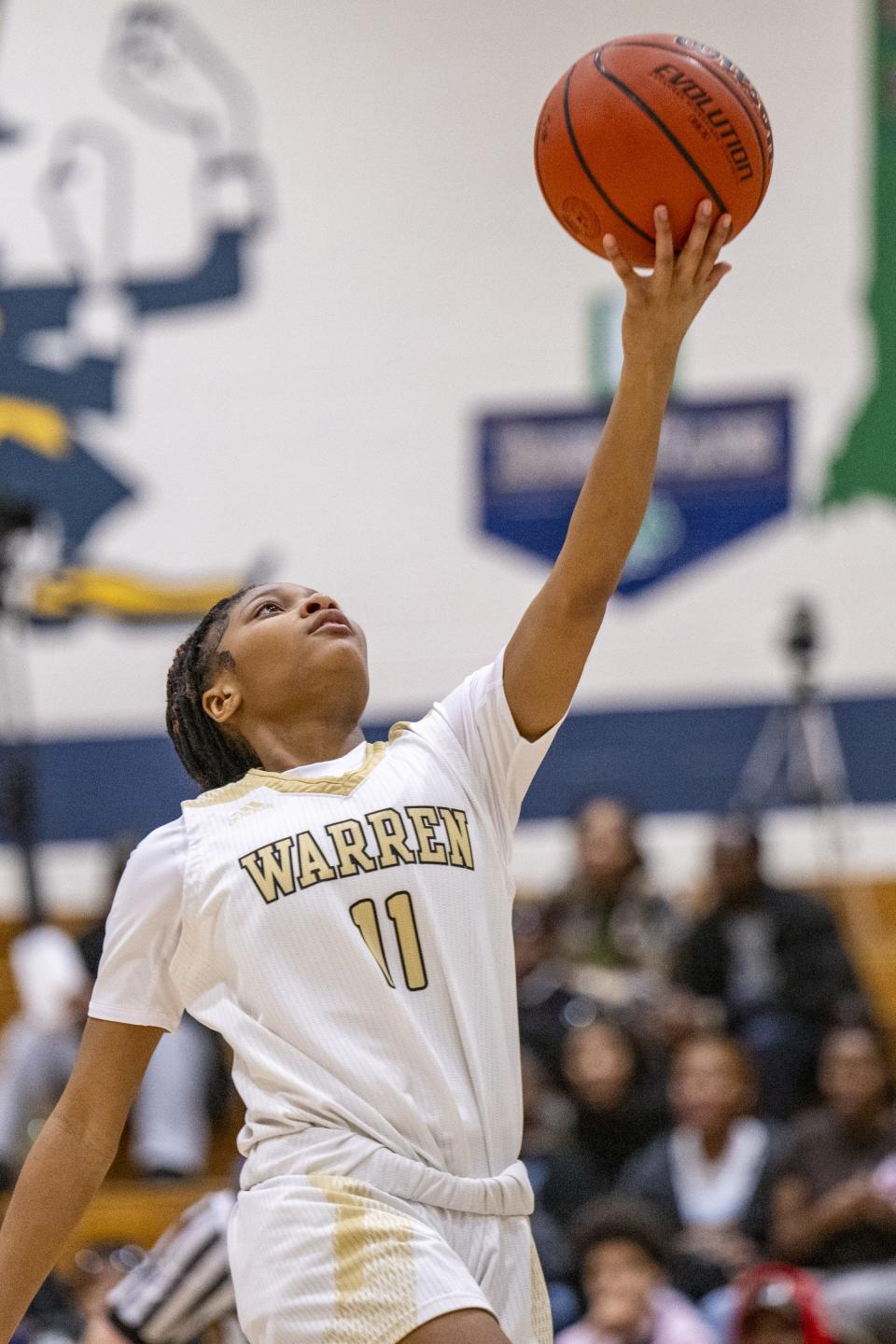 Warren Central High School sophomore Denell Jacobs (11) shoots a layup during the first half of an IHSAA Class 4A Sectional semi-final basketball game against Indianapolis Arsenal Technical High Schoo, Friday, Feb. 2, 2024, at Cathedral High School.