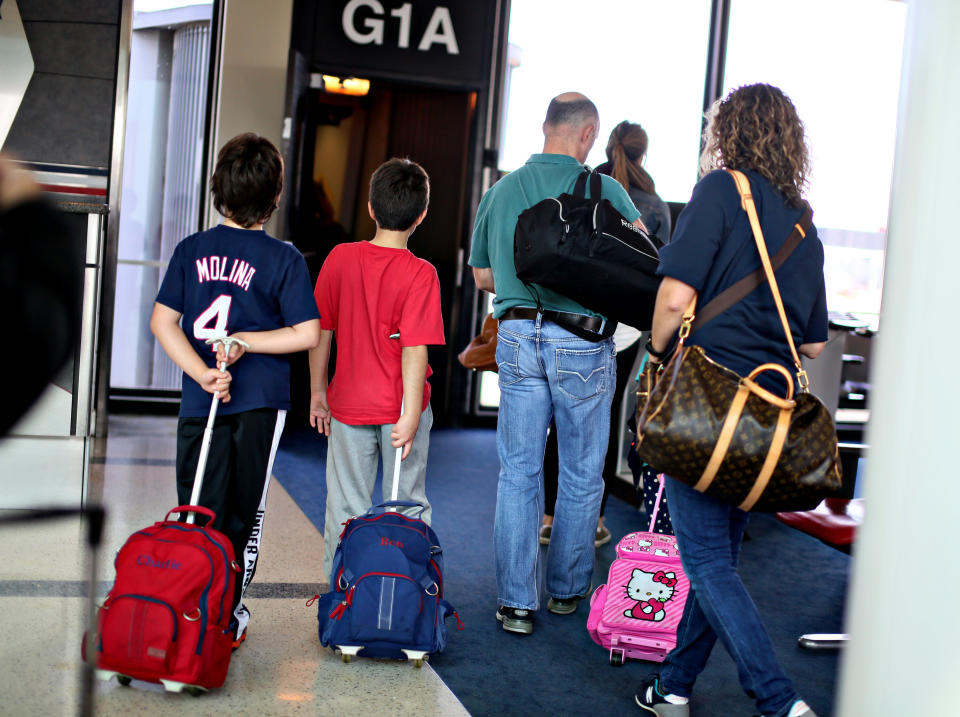 Passengers prepare to board their flight at O'Hare International Airport in Chicago, IL on Thursday, Oct. 10, 2013.&nbsp;