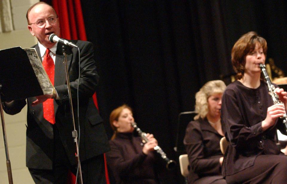 With the Monroe County College/Community Band providing a musical backdrop, college President David E. Nixon narrates the Christmas classic tale, "A Visit from St. Nicholas" in the band's 2003 holiday concert. Nixon not only called upon his broadcasting background to serve as an event host of local events, but he also played leadership roles in community organizations and projects.