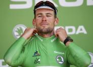 Cycling - Tour de France cycling race - The 190.5 km (118 miles) Stage 6 from Arpajon-sur-Cere to Montauban, France - 07/07/2016 - Team Dimension Data rider Mark Cavendish of Britain wears the best sprinter's green jersey on the podium after winning the stage. REUTERS/Juan Medina