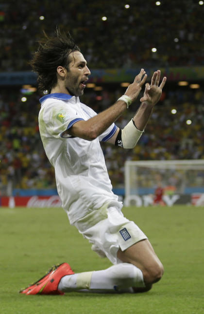 Greece&#39;s Giorgos Samaras celebrates scoring his side&#39;s second goal during the group C World Cup soccer match between Greece and Ivory Coast at the Arena Castelao in Fortaleza, Brazil, Tuesday, June 24, 2014. (AP Photo/Natacha Pisarenko)