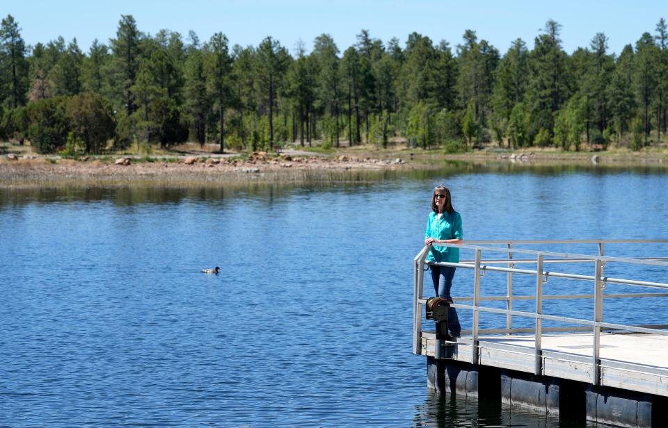 Mayor Stephanie Irwin on the fishing pier at Woodland Lake Park in Pinetop-Lakeside. The recreation area was thinned to lower the chance of severe fire damage.