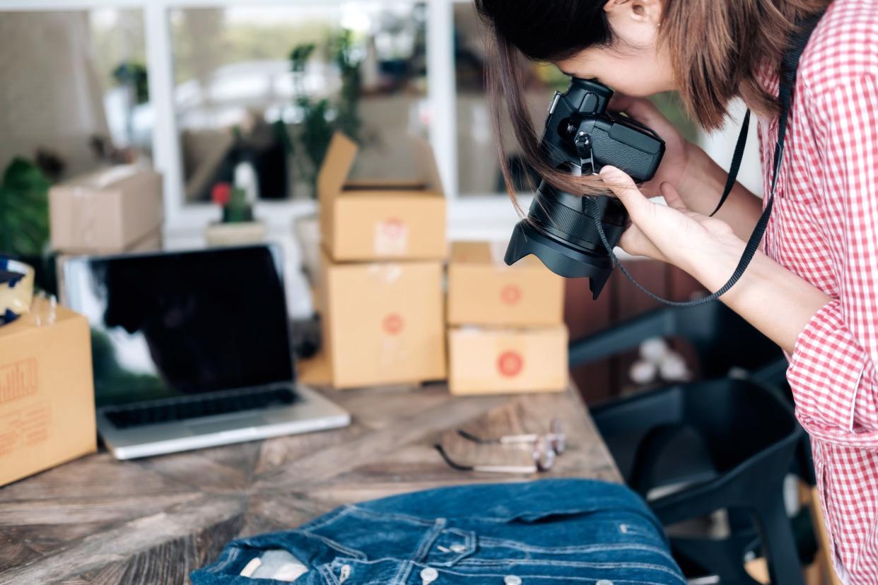 online seller takes a photo of jean jacket