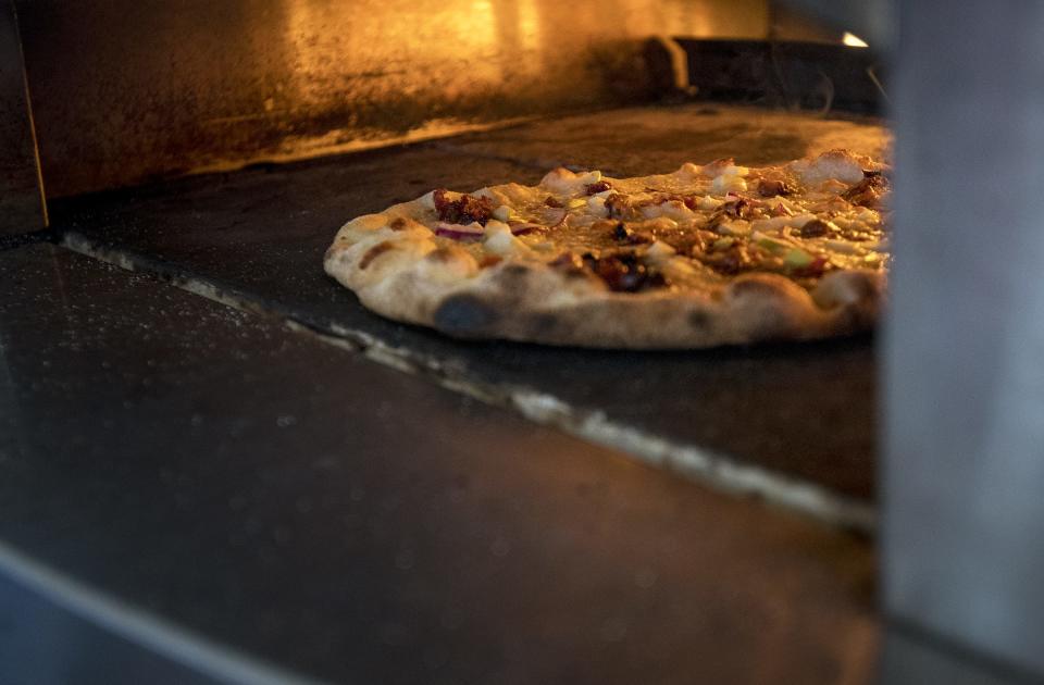 A Pizzeli pizza sits in the oven during the 5th annual Slice Night to benefit University of Cincinnati Cancer Institute's research at Yeatman's Cove Thursday, September 27, 2018 in Cincinnati, Ohio.