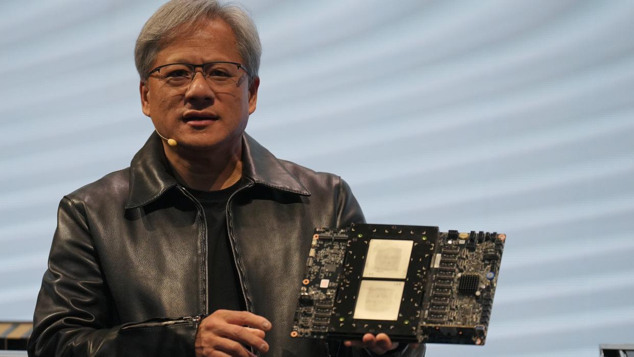  TAIPEI, TAIWAN - 2023/06/01: Jensen Huang, President of NVIDIA holding the Grace hopper superchip CPU used for generative AI at supermicro keynote presentation during the COMPUTEX 2023. The COMPUTEX 2023 runs from 30 May to 02 June 2023 and gathers over 1,000 exhibitors from 26 different countries with 3000 booths to display their latest products and to sign orders with foreign buyers. 