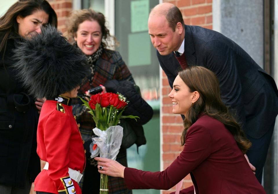 Prince William, Prince of Wales and Catherine, Princess of Wales receive flowers from Henry Dynov-Teixeira, 8, in Massachusetts (REUTERS)