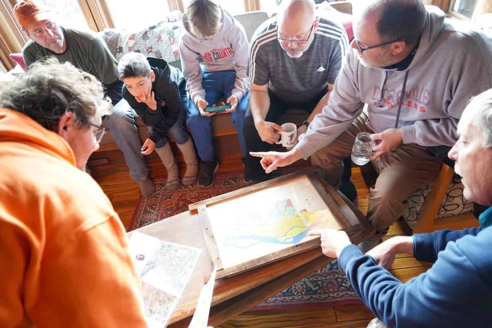 Hunters, including Mike Watt (second from right) of Dodgeville talk over plans for deer drives on Nov. 20, the second day of the 2022 Wisconsin gun deer hunting season. The group was hunting on the Leopold-Pines Conservation Area near Baraboo.