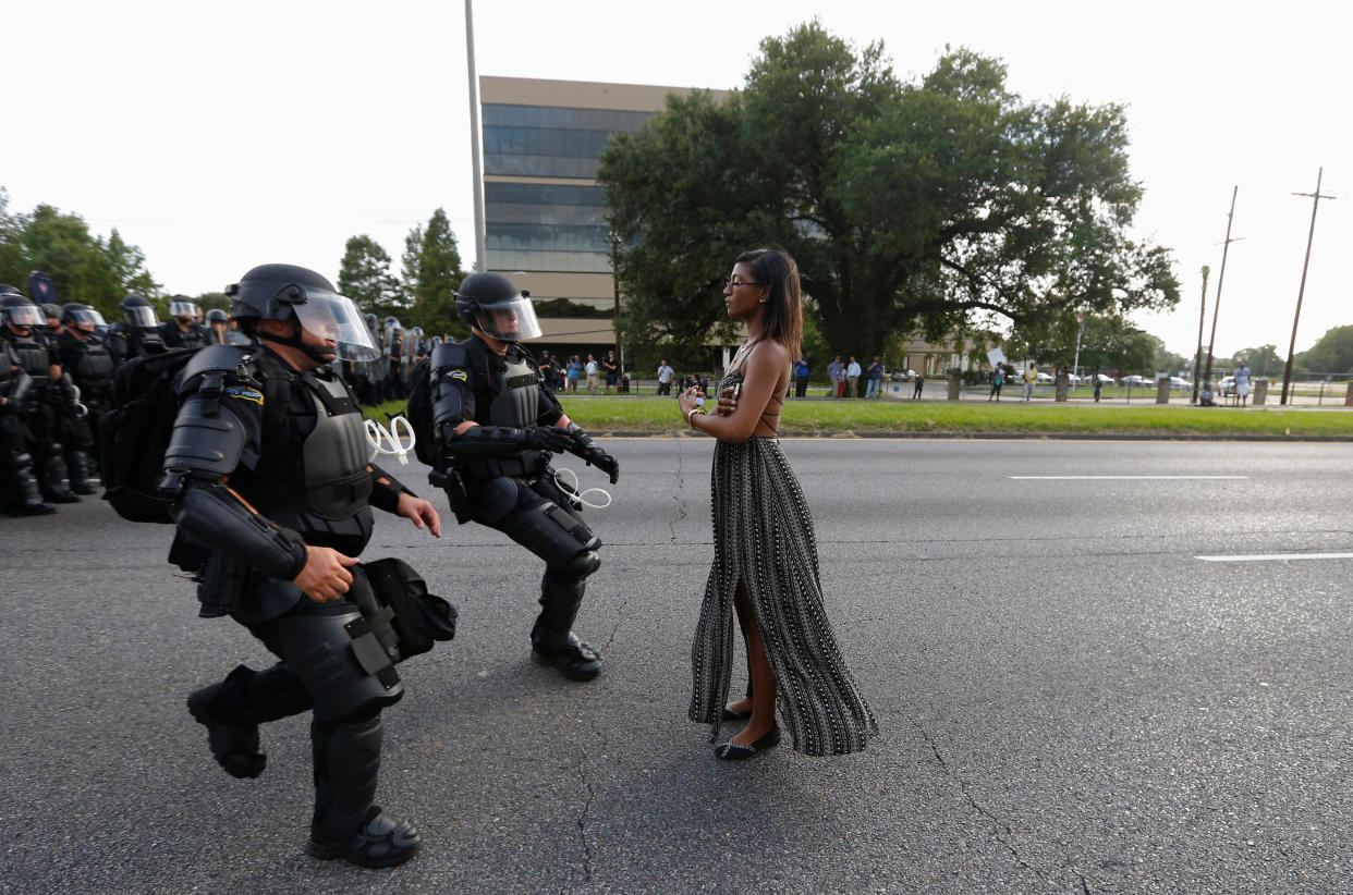 Protestor Ieshia Evans is approached by law enforcement near the headquarters of the Baton Rouge Police Department in Baton Rouge, Louisiana, U.S. July 9, 2016.   REUTERS/Jonathan Bachman         SEARCH "#BLACK LIVES MATTER" FOR THIS STORY. SEARCH "THE WIDER IMAGE" FOR ALL STORIES.