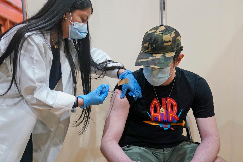 Alejandro Garcia, 16, receives his first dose of the Pfizer COVID-19 vaccine in West New York, N.J., Monday, April 19, 2021.