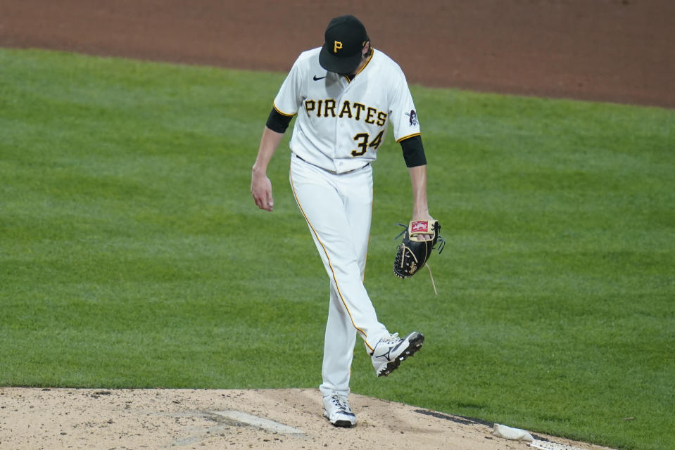 Pittsburgh Pirates starting pitcher JT Brubaker kicks at the mound after giving up a hit to Atlanta Braves' Vaughn Grissom that drove in a run during the fifth inning of a baseball game, Tuesday, Aug. 23, 2022, in Pittsburgh. (AP Photo/Keith Srakocic)