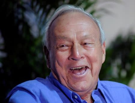 Golf legend Arnold Palmer smiles during a news conference before the start of play in the third round in the Arnold Palmer Invitational PGA golf tournament in Orlando, Florida March 24, 2012. REUTERS/David Manning/Files