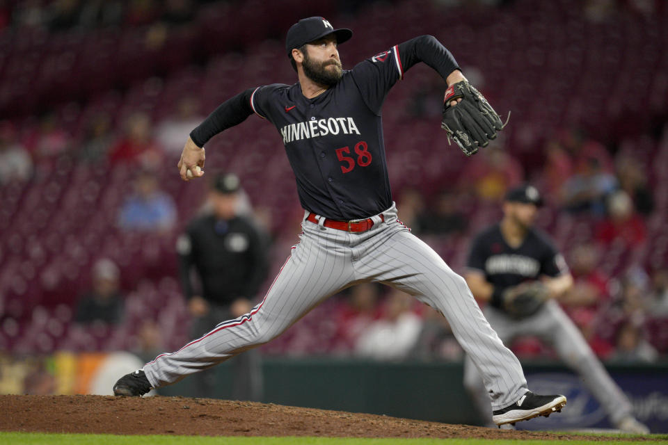 FILE - Minnesota Twins relief pitcher Dylan Floro throws against the Cincinnati Reds in the ninth inning of a baseball game in Cincinnati, Sept. 19, 2023. The Washington Nationals finalized a $2.25 million, one-year contract with reliever Floro on Tuesday, Dec. 12. (AP Photo/Jeff Dean, File)