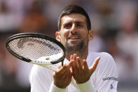 Serbia's Novak Djokovic reacts as he plays Poland's Hubert Hurkacz in a men's singles match on day eight of the Wimbledon tennis championships in London, Monday, July 10, 2023. (AP Photo/Alberto Pezzali)