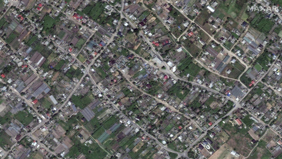 This image provided by Maxar Technologies, shows Oleshky, Ukraine before flooding, on May 15, 2023. (Satellite image ©2023 Maxar Technologies via AP)