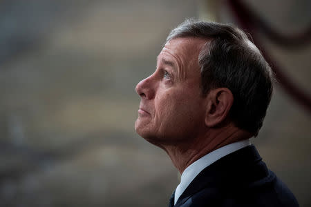 FILE PHOTO: Supreme Court Chief Justice of the United States John G. Roberts, Jr. waits for the arrival of former President George H.W. Bush to lie in State at the U.S. Capitol Rotunda on Capitol Hill on Monday, Dec. 03, 2018 in Washington. Jabin Botsford/Pool via Reuters/File Photo