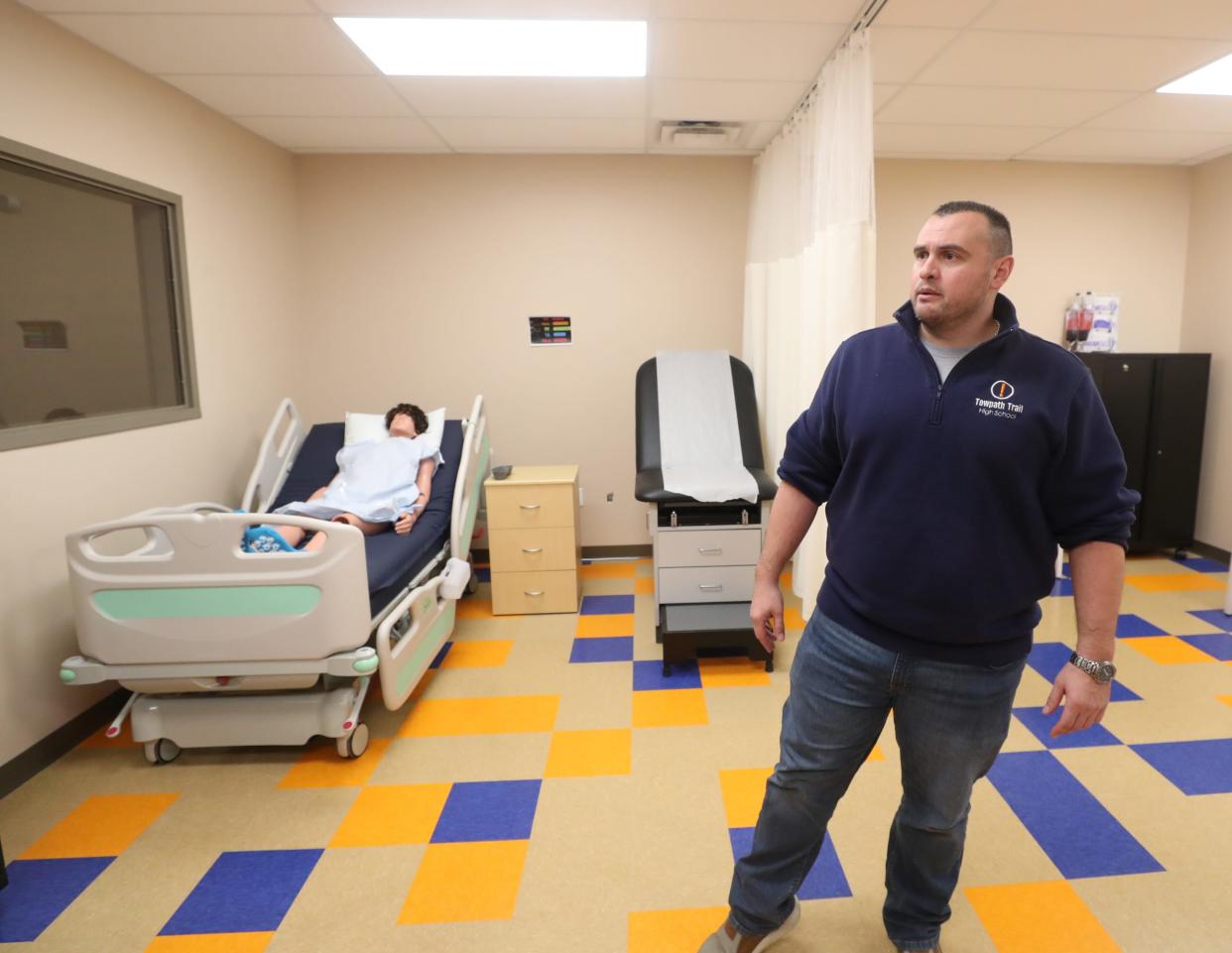 Matt Arshinkoff, director of Towpath Trail High School Barberton campus, talks about programs available while touring the health care room on Friday.