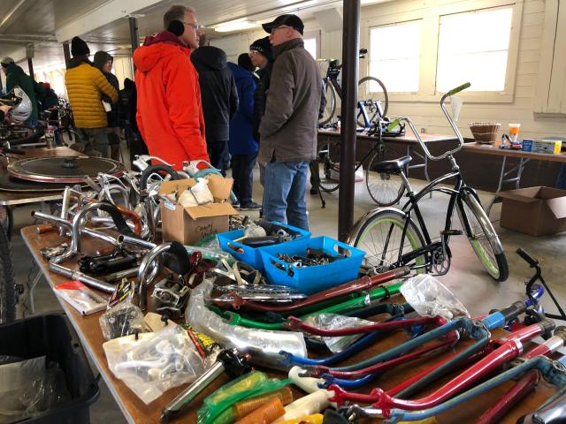 Bikes and accessories line up for shoppers at 2022's bike swap meet at St. Patrick's County Park in South Bend.