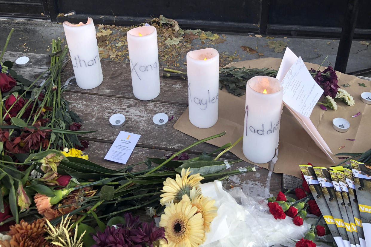 Candles and flowers are left at a make-shift memorial honoring four slain University of Idaho students outside the Mad Greek restaurant in downtown Moscow, Idaho, on Tuesday, Nov. 15, 2022. Police discovered the bodies of the four students at home near campus on Sunday, Nov. 13, 2022, and said the killer or killers used a knife or bladed weapon in the targeted attack. Two of the victims, 21-year-old Madison Mogen and 20-year-old Xana Kernodle, were servers at Mad Greek. (Nicholas K. Geranios / AP)