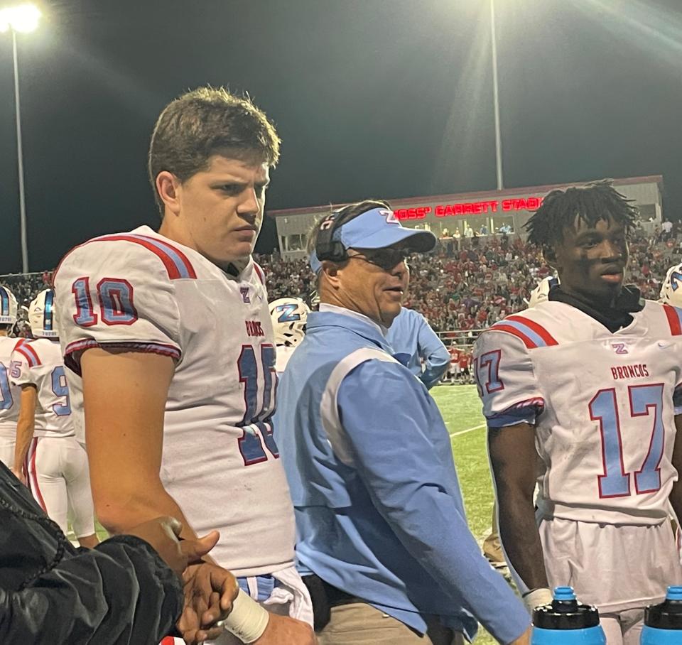 Zachary quarterback Eli Holstein, an Alabama commit, talks with his coaches during his game against Ruston Friday in the LHSAA Non-Select Division I semifinals in Ruston.