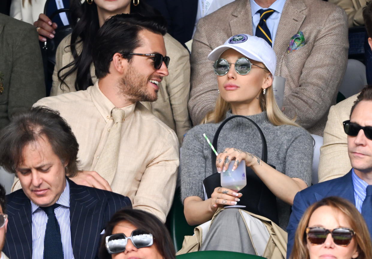 LONDON, ENGLAND - JULY 16: Jonathan Bailey and Ariana Grande watch Carlos Alcaraz vs Novak Djokovic in the Wimbledon 2023 men's final on Centre Court during day fourteen of the Wimbledon Tennis Championships at All England Lawn Tennis and Croquet Club on July 16, 2023 in London, England. (Photo by Karwai Tang/WireImage)