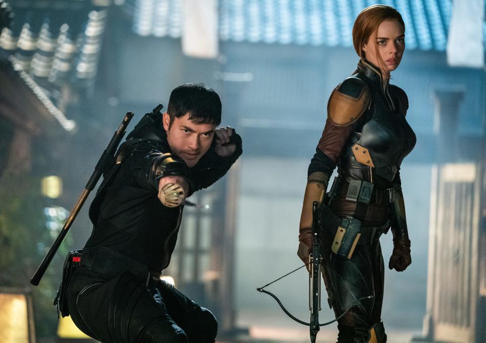 Snake Eyes (Henry Golding) fights alongside Scarlett (Samara Weaving), a member of the G.I. Joe team, in "Snake Eyes."