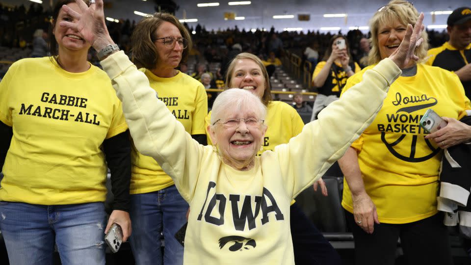 Dee Vanderhoef, an Iowa Hawkeyes fan and season ticket holder since the 1970s, cheers prior to tipoff against the Holy Cross Crusaders during the first round of the tournament. - Rebecca Gratz/NCAA Photos/Getty Images