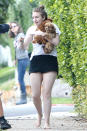 The <em>Girls</em> creator was spotted barefootin’ with her dogs, Susan and Karen, in L.A. (Photo: PacificCoastNews)