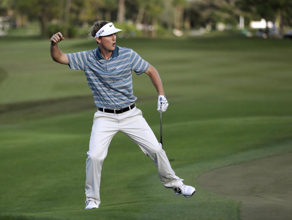 Russell Henley celebrates as he tied for the lead by chipping in for birdie on the 14th hole during the final round of the Honda Classic golf tournament, Sunday, March 2, 2014, in Palm Beach Gardens, Fla. Henley won the tournament after a four-man playoff. (AP Photo/Wilfredo Lee)