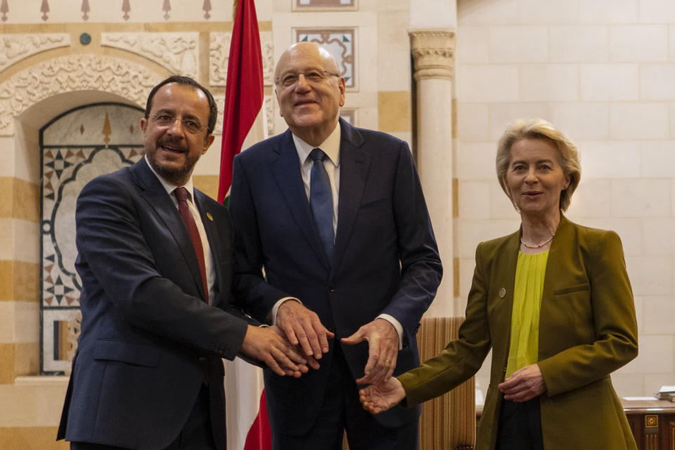 Lebanese caretaker Prime Minister Najib Mikati, center, Cyprus' President Nikos Christodoulides, left, and President of the European Commission Ursula von der Leyen pose for photograph at the government palace in Beirut, Lebanon, Thursday, May 2, 2024. (AP Photo/Hassan Ammar)