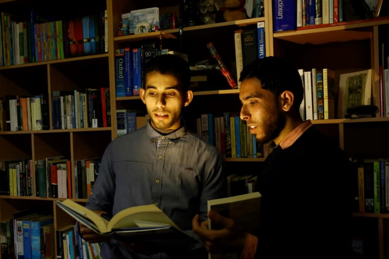 Mossab Abo Toha (L) and his friend Shafi Salem, want to open the first English-language library in the beleaguered Palestinian territory