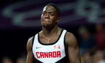 Canada's Justyn Warner reacts to being disqualified in the 4x100-metre relay at the 2012 Summer Olympics in London on Saturday, August 11, 2012. THE CANADIAN PRESS/Sean Kilpatrick