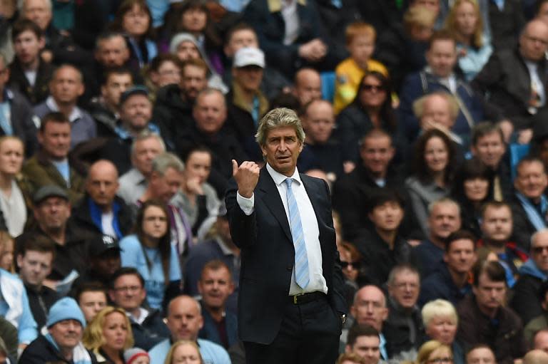 Manchester City manager Manuel Pellegrini gestures from the touchline during his side's Premier League match against Southampton at Etihad Stadium on May 24, 2015