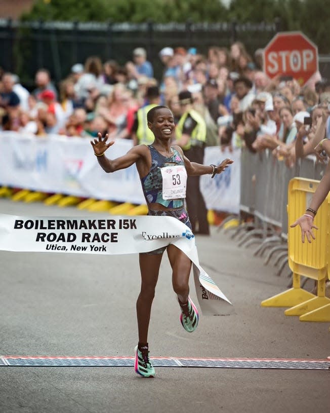 Boilermaker 15K women's winner Jesca Chelangat crosses the finish line.
