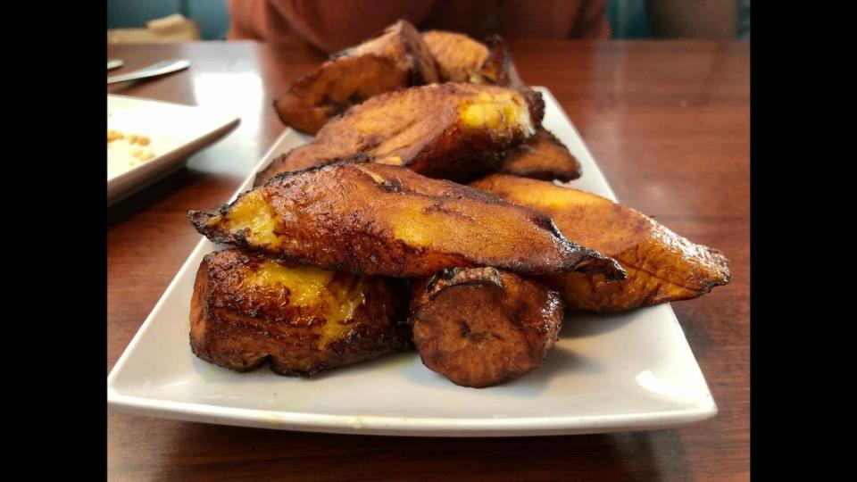 Some of Palace Food Services’ main dishes come with large dishes of sweetened, fried plantains.