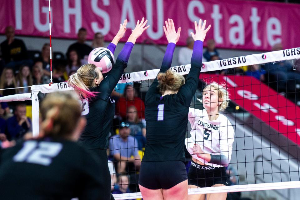 Ankeny Centennial's Jada Schmidt (5) gets a kill against Iowa City Liberty during Wednesday's Class 5A state volleyball semifinal match against Iowa City Liberty.