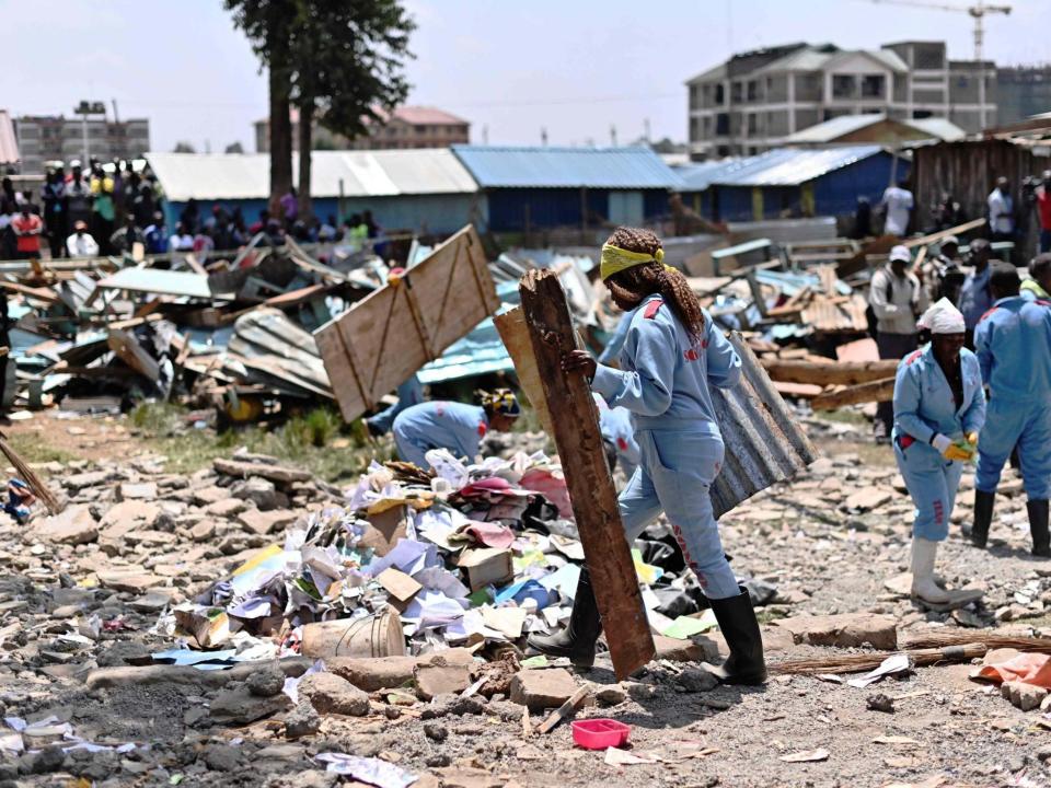 Rescuers tackle the devastation around a collapsed school building in Nairobi, where seven have died and dozens been left with injuries: AFP/Getty