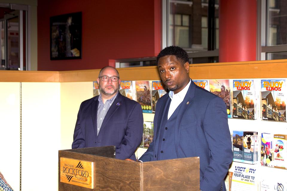 Rockford Area Convention & Visitors Bureau CEO John Groh, left, looks on as Illinois Rep. Maurice West, D-Rockford, announces a $1.5 million COVID-relief grant for Winnebago County restaurants Monday, Feb. 26, 2024, in downtown Rockford.