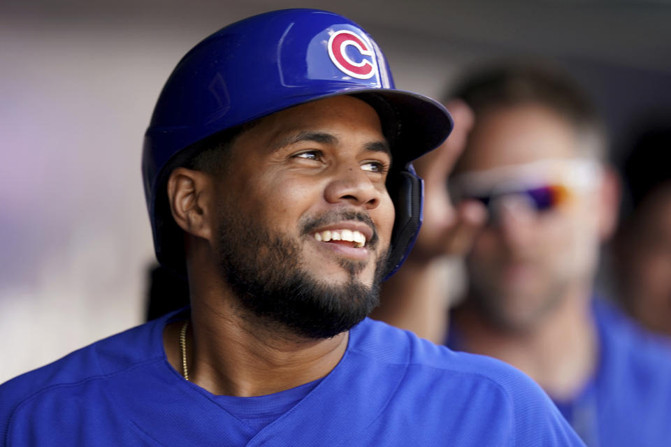 Chicago Cubs' Jeimer Candelario celebrates in the dugout after he hit a two-run home run against the Pittsburgh Pirates in the fourth inning of a baseball game in Pittsburgh, Sunday, Aug. 27, 2023. (AP Photo/Matt Freed)