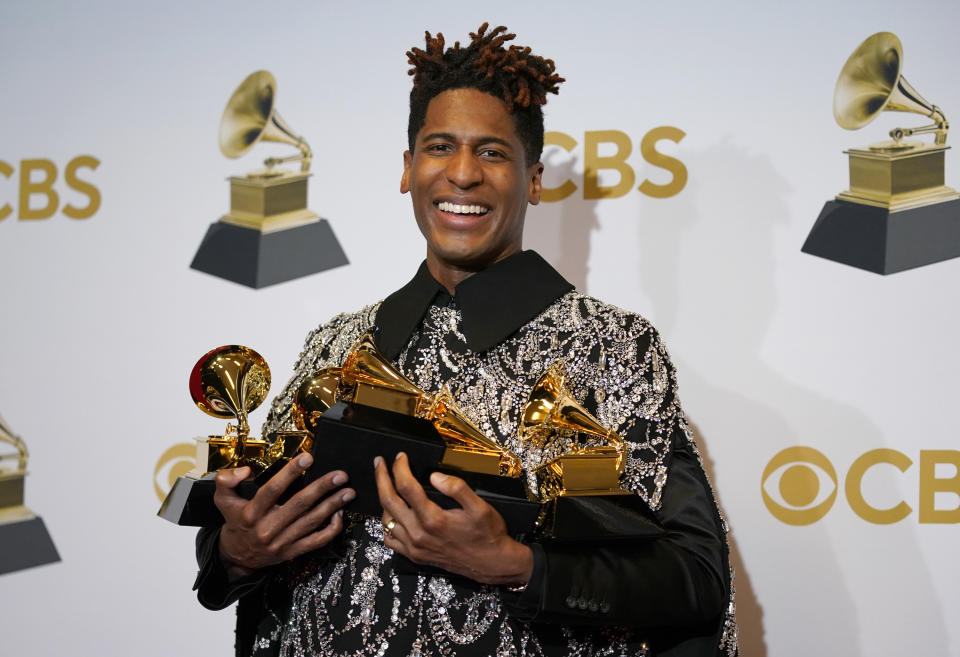 Jon Batiste, winner of the awards for best American roots performance for "Cry," best American roots song for "Cry," best music video for "Freedom," best score soundtrack for visual media for "Soul," and album of the year for "We Are," poses in the press room at the 64th Annual Grammy Awards at the MGM Grand Garden Arena on Sunday, April 3, 2022, in Las Vegas. (AP Photo/John Locher)