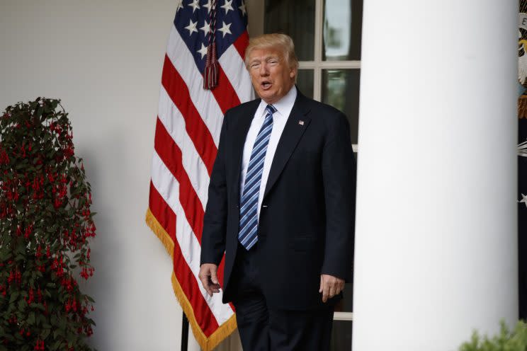 President Trump talks with reporters as he walks to the Oval Office on May 2. (Photo: Evan Vucci/AP)