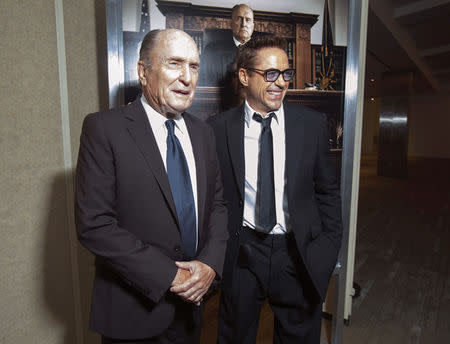 Cast members Robert Duvall and Robert Downey Jr. pose at the premiere of "The Judge" at the Academy of Motion Picture Arts and Sciences in Beverly Hills, California October 1, 2014. REUTERS/Mario Anzuoni